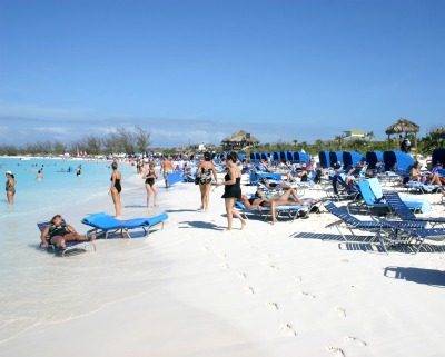 Cruise passengers are relaxing and having a great time on the beach.